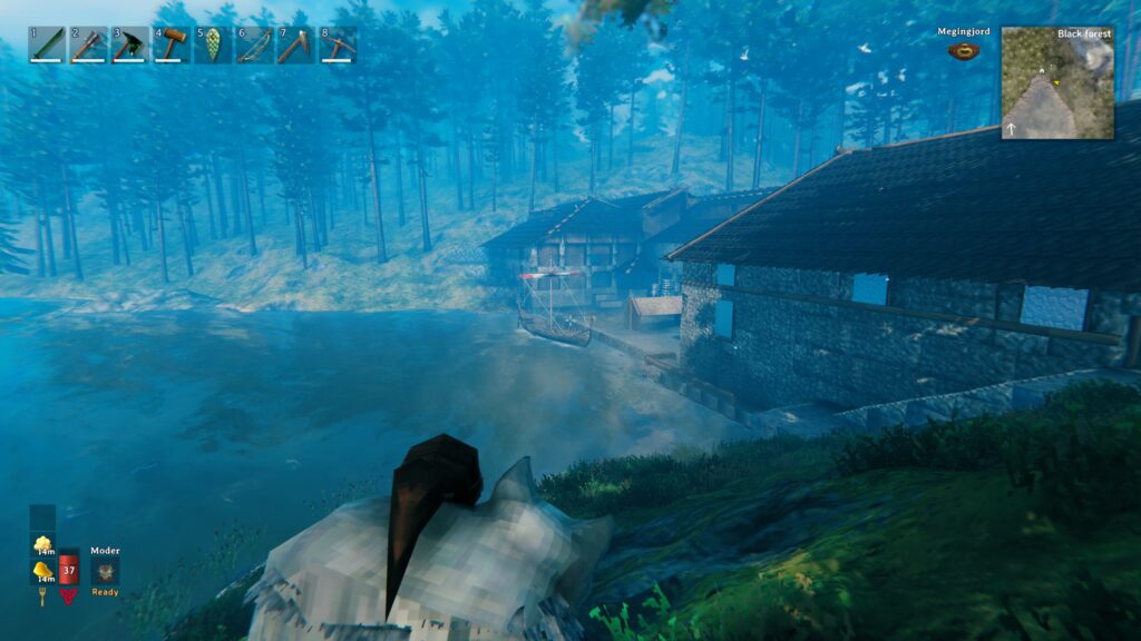 Video game screenshot from Valheim featuring a large stone building with wooden roof.